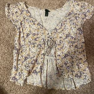 Floral blouse crop top (split down the middle) recommended a tank top under